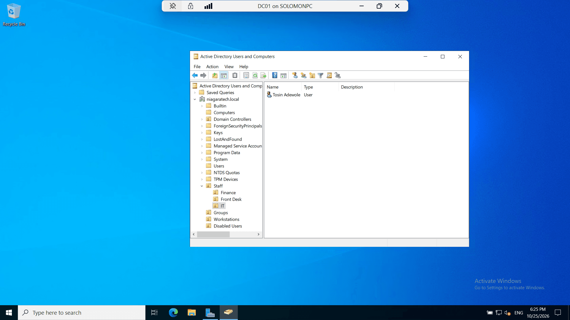 Users and PCs organized into department OUs